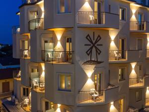 a building with lights on the side of it at Hotel Holland in Rimini