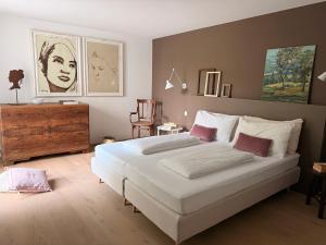 a bedroom with a large white bed in a room at Villa Prince Garda in Salò +91 photos