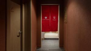 a hallway with a red curtain in a room at Anook Hotel & Spa Bucheon Sangdong in Bucheon