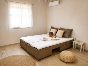 a bedroom with a large bed in a room at Paliokaliva Home in Roussopoúlion