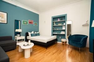a living room with a bed and a couch at Hyper Centre Place Kléber Appart in Strasbourg