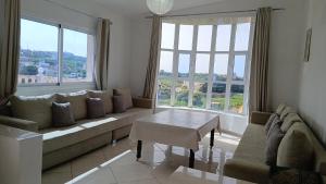 a living room with a couch and a table at Mediterraneo House in Tangier