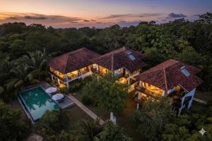 an aerial view of a house with a swimming pool at Ashansa Lagoon Resort in Tangalle