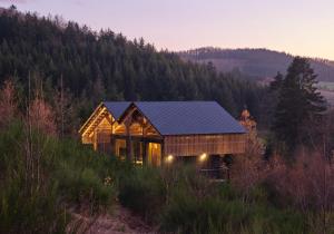 a house on a hill with a solar roof at Hutstuf Bertogne in Bertogne
