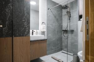 a bathroom with a shower and a sink at CIA apartmani - Arandjelovac Bekatown Apartment in Arandelovac +10 photos