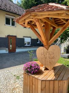 a wooden heart with a sign that reads fifteen working nursesketemeteryemetery at Thaya-Auszeit in Thaya
