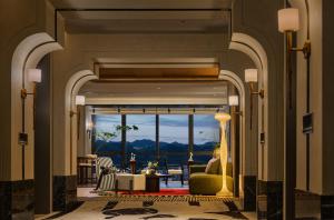 a living room with a view of the ocean at Aranciel 阿岚若 High-Rise River View Hotel -Jiefangbei Area-Hongya Cave in Chongqing
