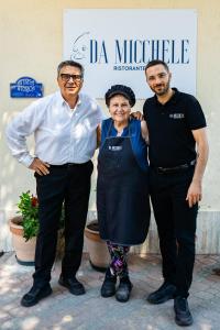 two men and a woman posing for a picture at Da Micchele Rooms in Vasto