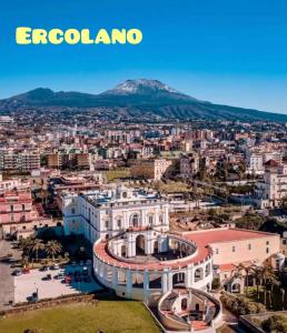 a city with a mountain in the background at Casa vacanze Carmen House in Ercolano