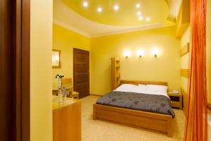 Posteľ alebo postele v izbe v ubytovaní Hotel Pory Roku