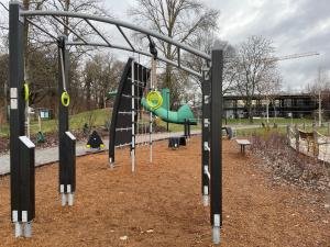 an empty playground with a slide and swings at Story Living Lidingö in Stockholm +22 photos