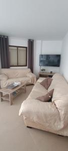 a woman laying on a bed in a room at Complejo Vallsun in Estepona