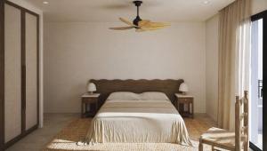 a bedroom with a bed and a ceiling fan at Anoi Kefalonia in Argostoli