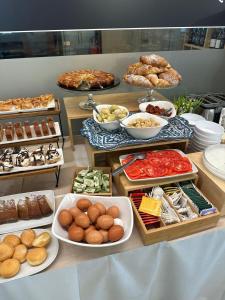 a buffet with many different types of food on display at YEASY smart rooms Cefalù in Cefalù