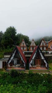 a building with a bunch of windows at Villa Platinum 2 in Banjarnegara