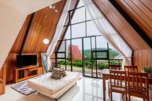 a large living room with a large window at Villa Platinum 2 in Banjarnegara