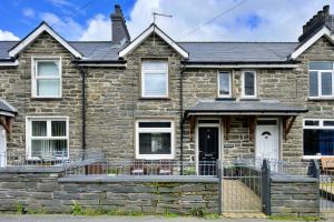 a stone house with a front porch at Finest Retreats - Garreg Ddu in Blaenau-Ffestiniog