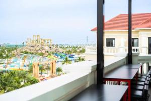 a view of a water park from the balcony of a resort at Ocean Homes cơ sở SH24 in Ðình Loan