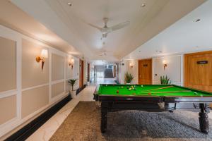 a pool table in a room with a ceiling at Ginger Rishikesh, Dehradun Road in Rishīkesh