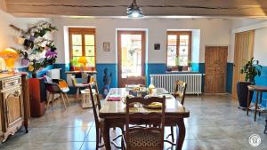 a dining room with a table and chairs at Chez l'tiote morvandelle in Montigny-en-Morvan