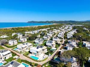 an aerial view of a large apartment complex next to the ocean at Olive Tree Apartment - 290 in Mullini i Danit +27 photos