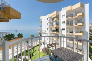a rendering of the balcony of a building with the ocean at Apartment Overlooking the Beach in Marbella