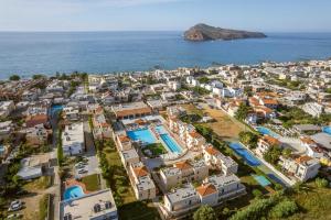an aerial view of a city and the ocean at Kambos Village in Agia Marina Nea Kydonias