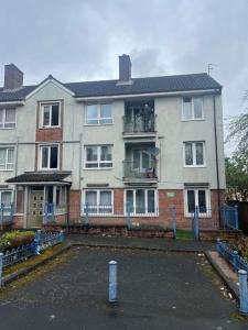 a large house with a parking lot in front of it at Budget Central Birmingham in Birmingham