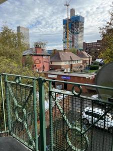 a balcony with a view of a city with buildings at Budget Central Birmingham in Birmingham