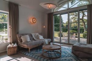 a living room with a couch and a table at Apartment Søglas in Gmund am Tegernsee +14 photos