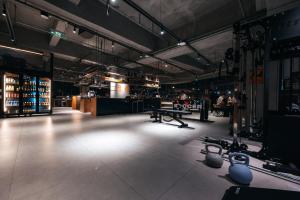 a large room with a bar with tables in it at F18 Hub Youth Hostel in Chengdu