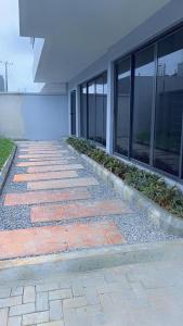 a brick walkway in front of a building at The Abode in Lekki Phase 1