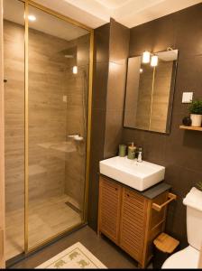 a bathroom with a sink and a shower at W beach house in Buljarica
