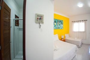 Uma cama ou camas num quarto em Chales Maria Flor