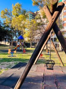 a park with a swing set and a playground at Casa Acquarello in Savona