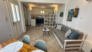 a living room with a couch and a table at Katias Villa in Alonnisos