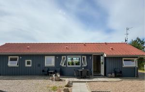 a blue house with a red roof at Awesome Home In Gørlev With Wifi in Gørlev +11 photos