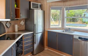 a kitchen with a stainless steel refrigerator and a sink at Awesome Home In Gørlev With Wifi in Gørlev