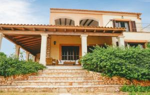 a house with stairs in front of it at Sa Tanqueta De Calonge in Santanyi