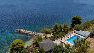 an aerial view of a house next to the water at Katias Villa in Alonnisos