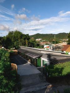 an overhead view of a building with a roof at Sandana Studio Apartments - Studio 2 in Nathon Bay