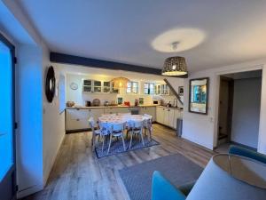 a kitchen and dining room with a table and chairs at Balea Gorri in Ciboure +16 photos