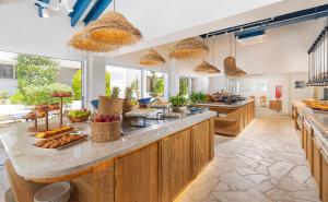 a kitchen with a counter with food on it at Greek Village - Latchi הכפר היווני - כשר in Polis Chrysochous