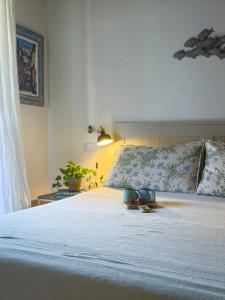 a bedroom with a bed with two shoes on it at Indarsena b&b in Portoferraio