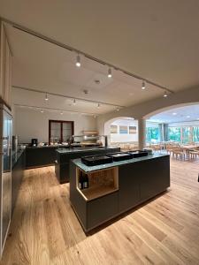 a large kitchen with an island in a room at Haus der Achtsamkeit in Grünau im Almtal