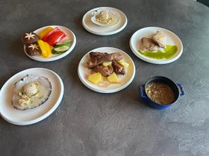 a group of plates of food on a table at The SENSE FUJI in Narusawa
