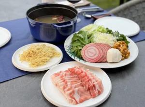 a table with plates of food and a bowl of soup at The SENSE FUJI in Narusawa +56 photos