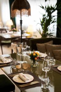 a table with wine glasses and napkins on it at The Fiction in Athens