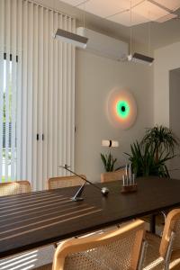 a dining room with a wooden table and chairs at Casa Palmera in Pridraga +83 photos
