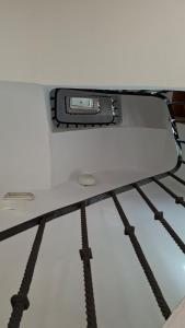 a cell phone sitting on top of a bed at Balcón de Manet in Valencia